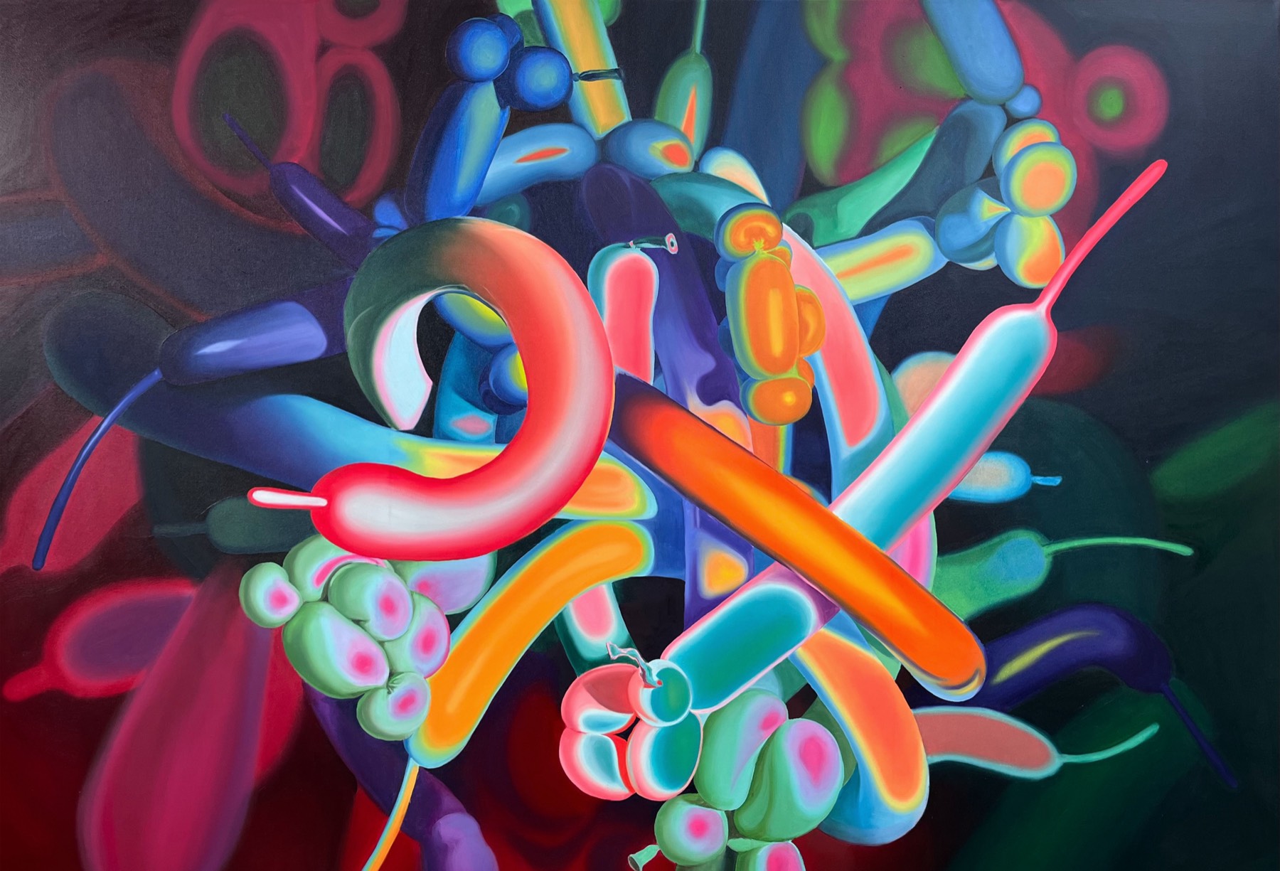 A wide canvas: a knot of modelling balloons in orange, pink, blue and green, twisted around each other and lit against a black background.