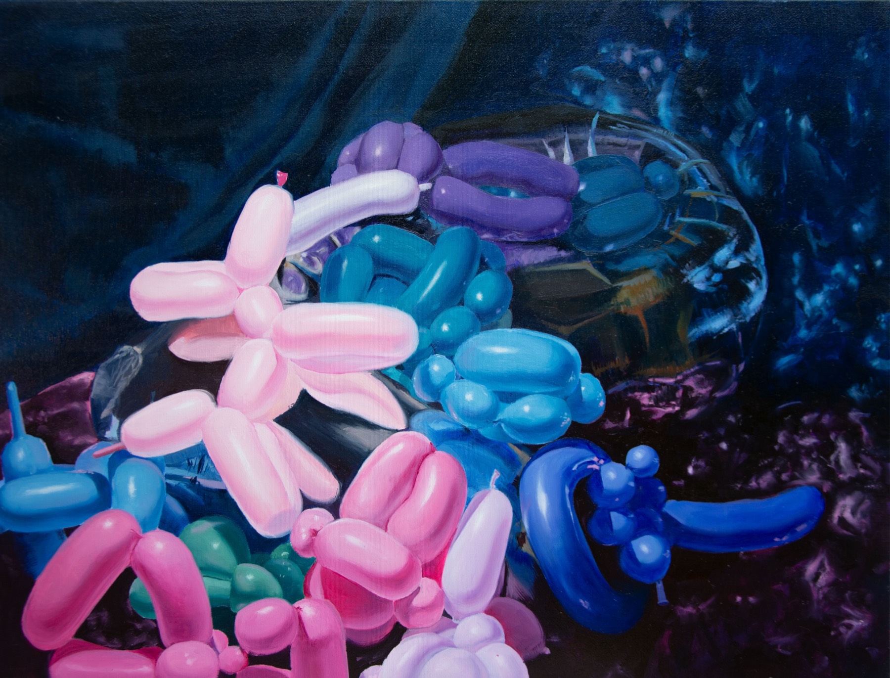 A horizontal canvas: a heap of pink, blue, violet and green modelling balloons piled on dark drapery, with a large glass vessel behind them.